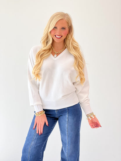 White cashmere-blend V-neck dolman boyfriend sweater with ribbed cuffs