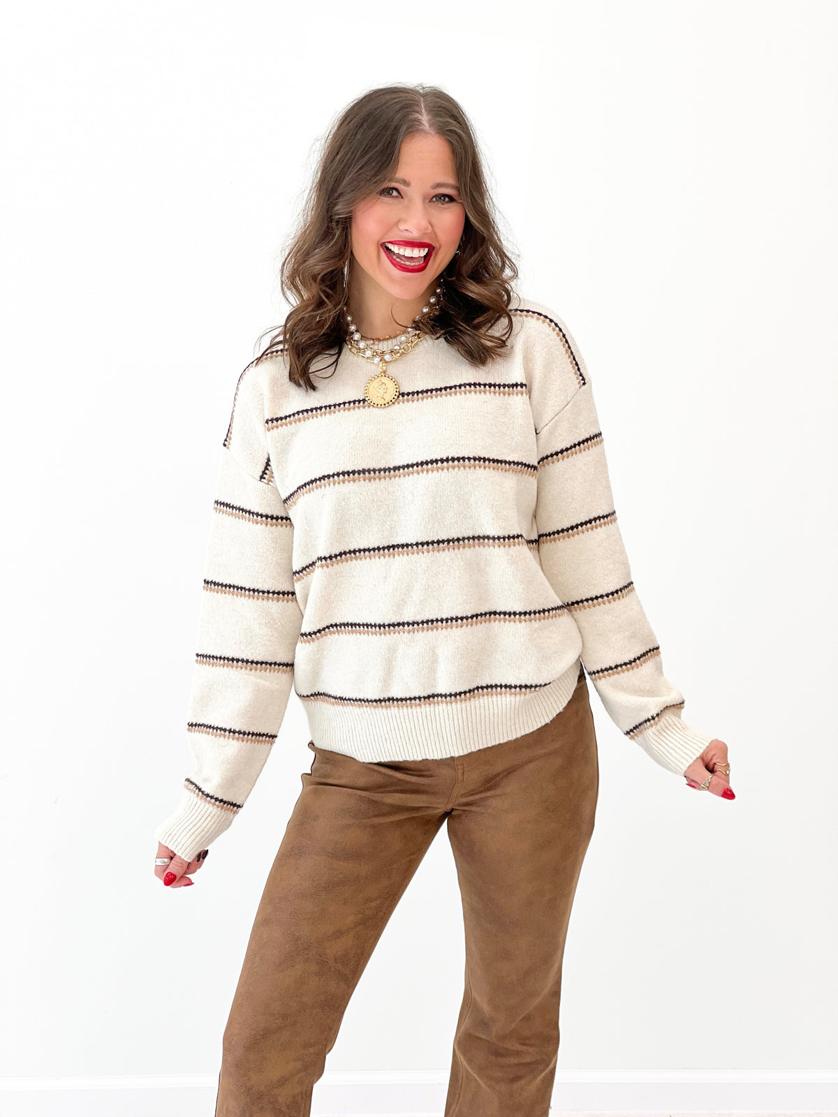 Oatmeal knit striped sweater pullover with crew neck and ribbed cuffs