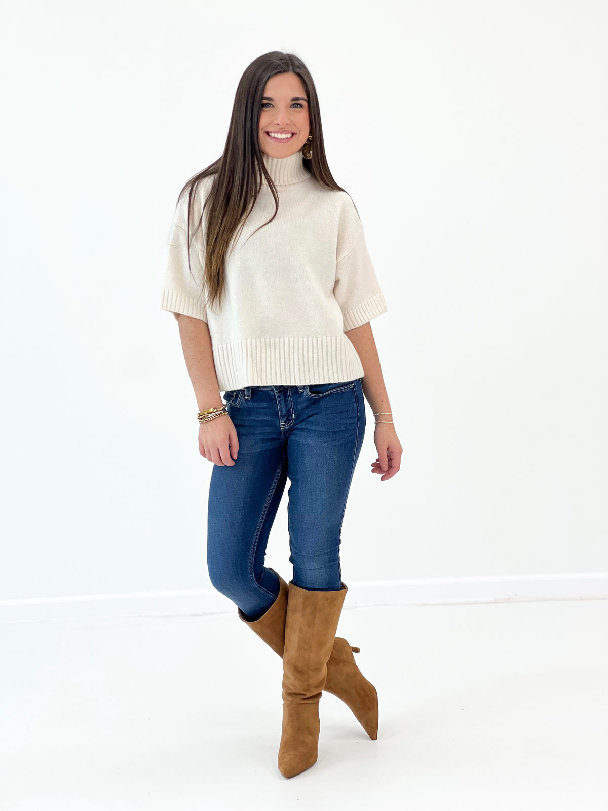 Off-white short-sleeve turtleneck knit sweater with ribbed neckline and hem