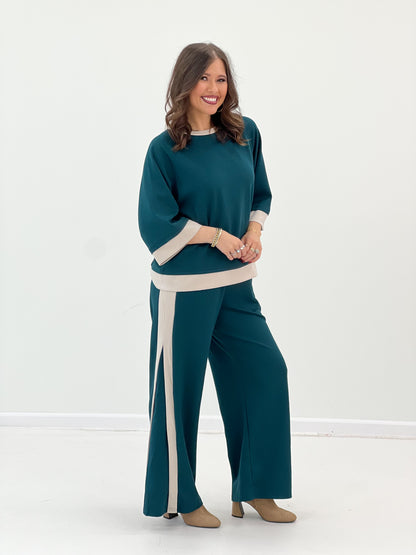 Women’s teal knit colorblock set: long sleeve top with cream cuffs and wide-leg pants
