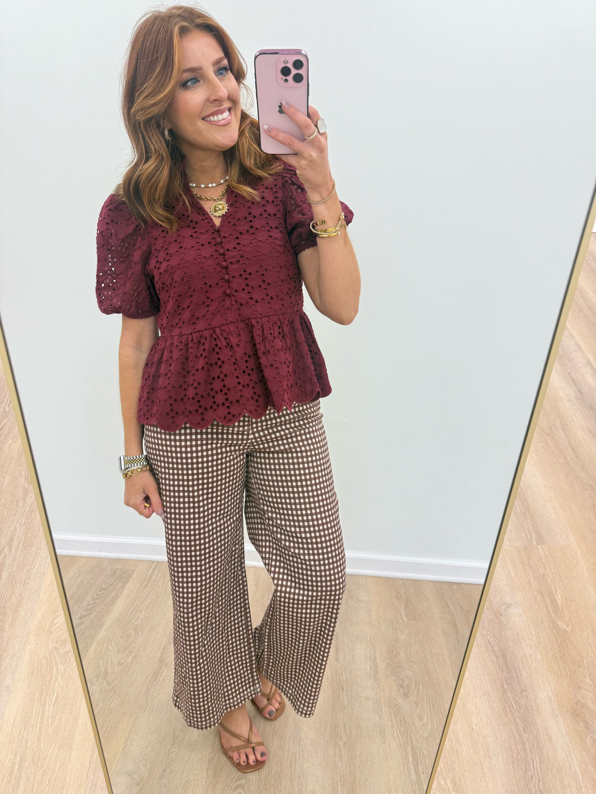 Burgundy eyelet ruffle-neck top with scalloped peplum hem and short puff sleeves