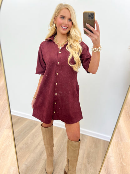 Burgundy suede button-down mini dress with scalloped neckline and short sleeves