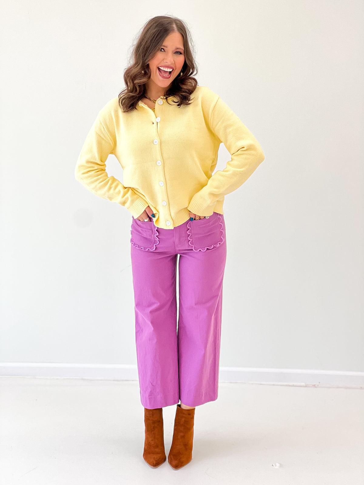 Yellow button-up cardigan with round neck and front buttons, long sleeves