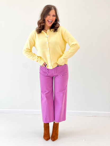 Yellow button-up cardigan with round neck and front buttons, long sleeves