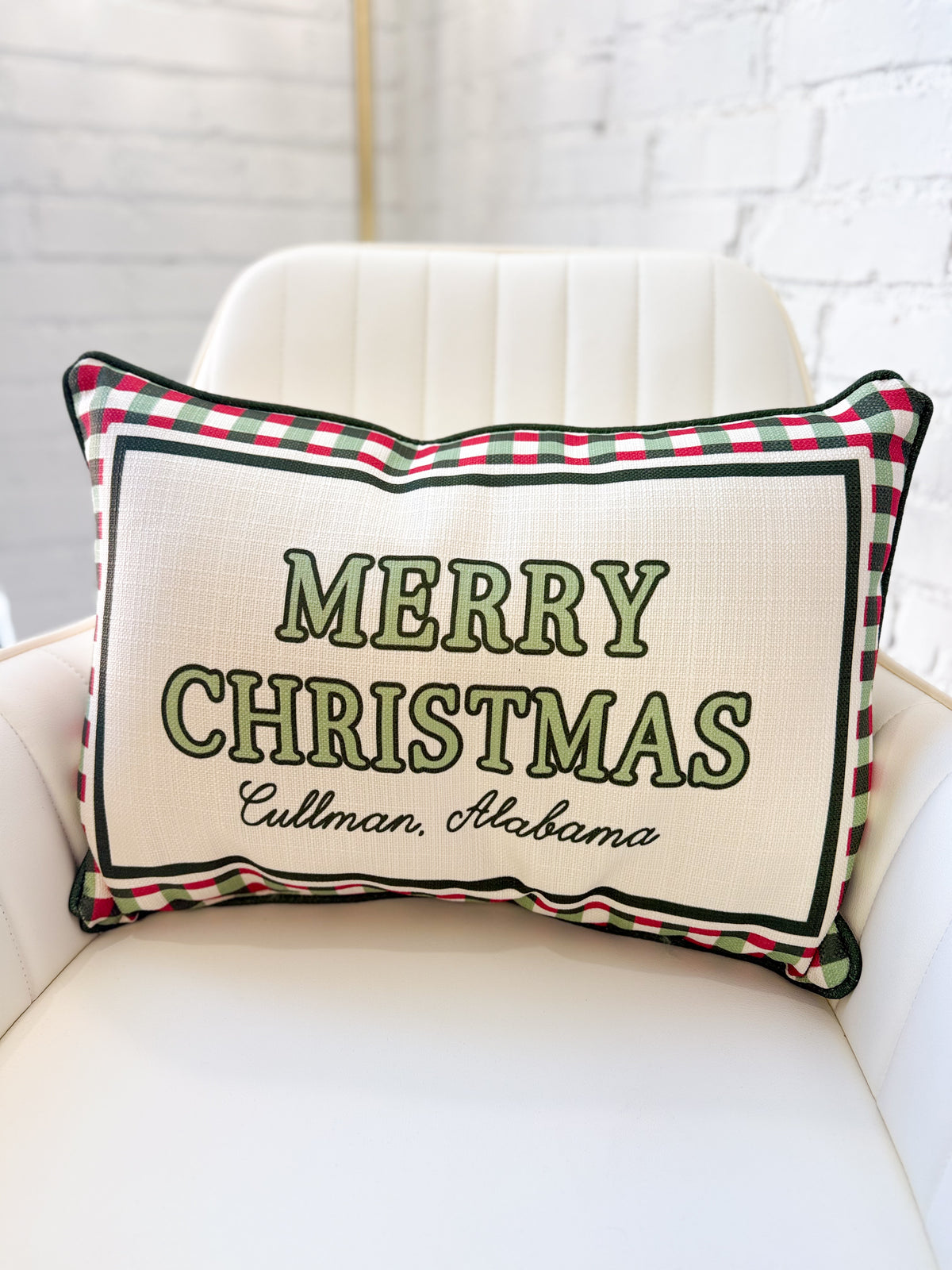 Cream Christmas pillow with red-green plaid trim; green 'MERRY CHRISTMAS' and 'Cullman, Alabama'