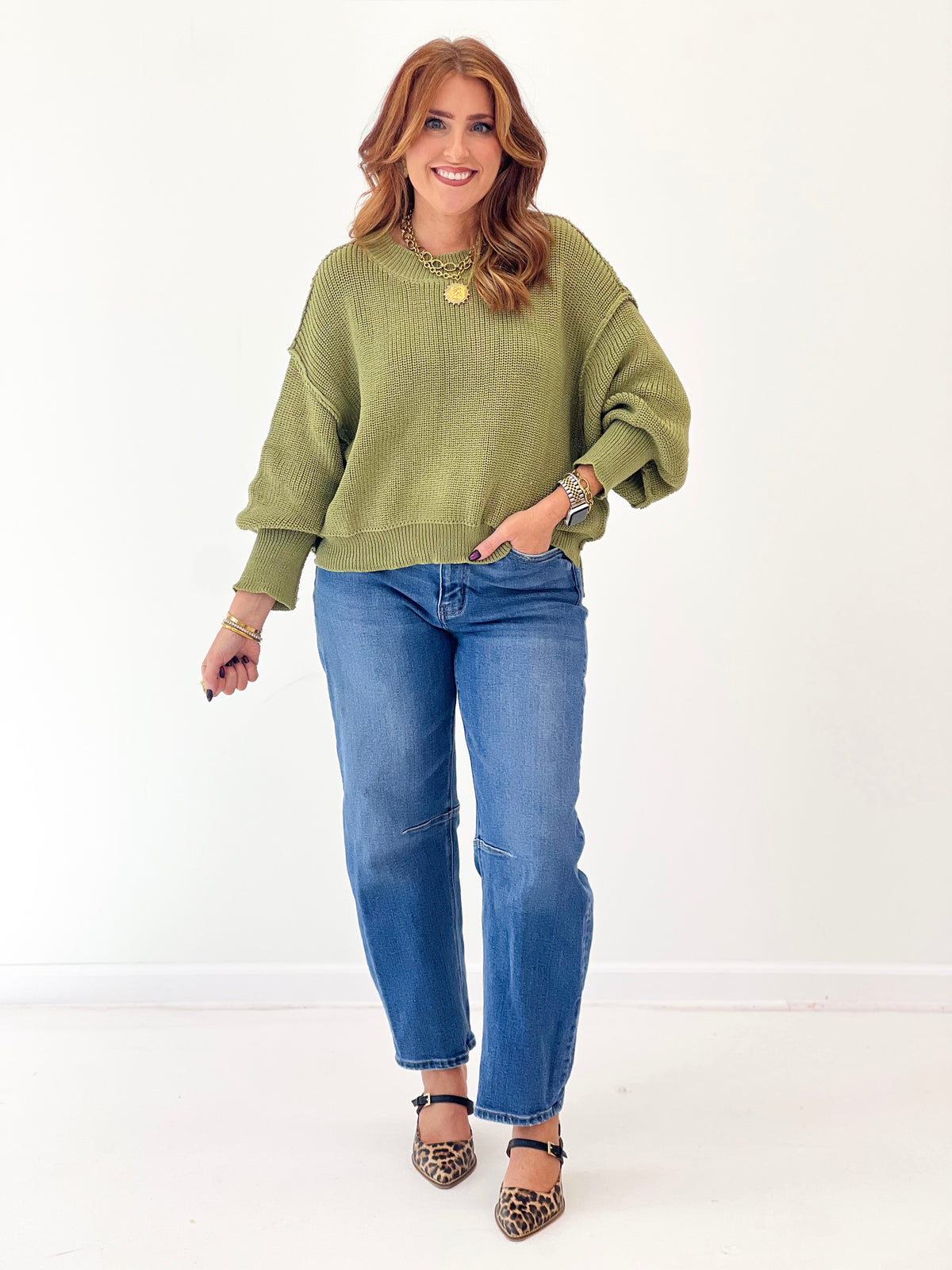 Olive mock-neck oversized sweater with long sleeves and ribbed neckline
