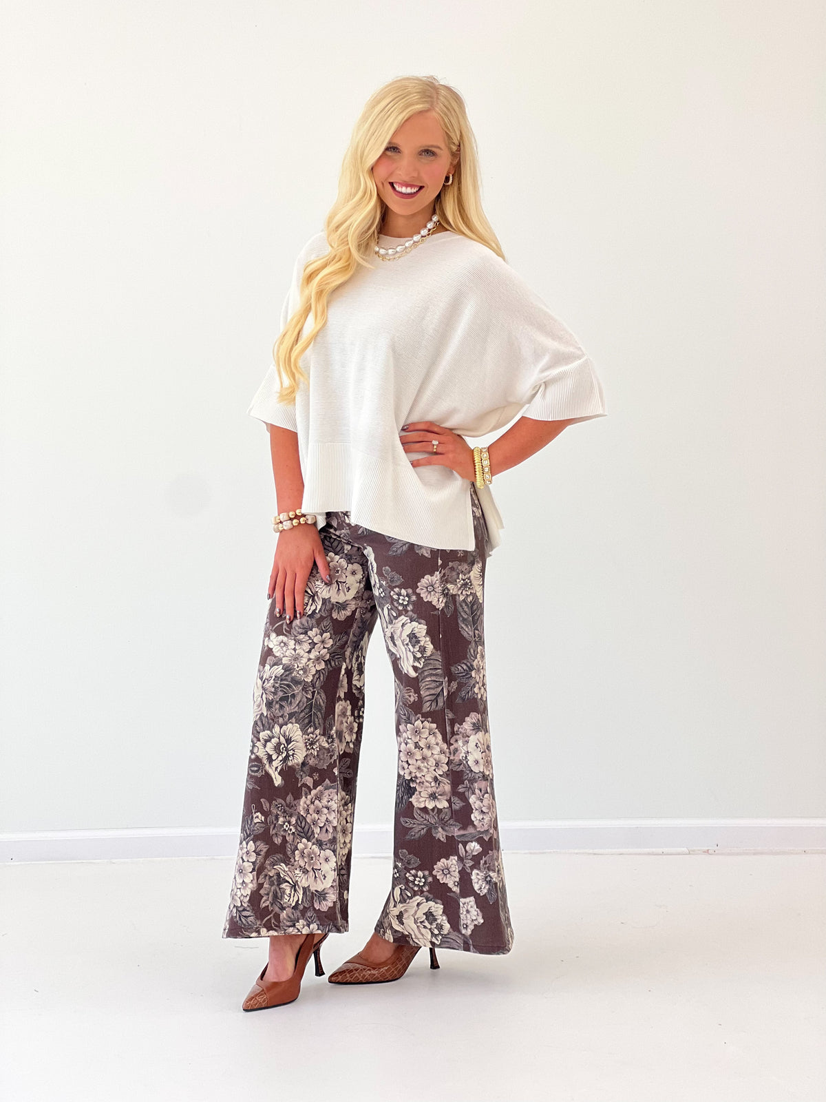 Ivory oversized pullover sweater with draped short sleeves and round neckline
