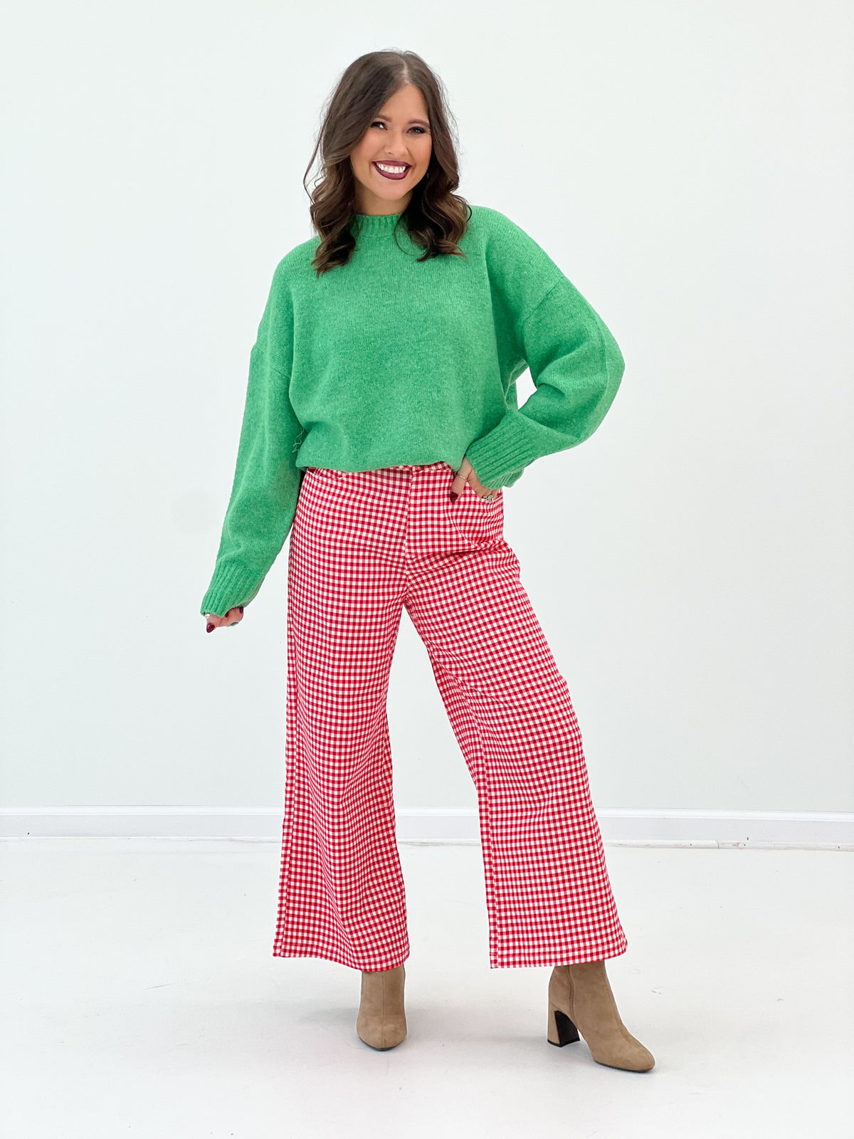 Green ribbed crew neck sweater, cozy knit texture and ribbed hemline