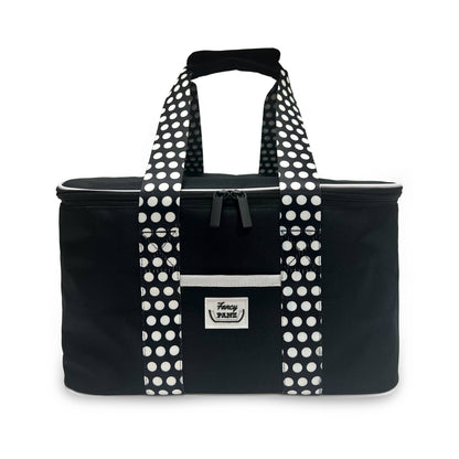 Black insulated travel tote with polka-dot handles and front drawstring pocket