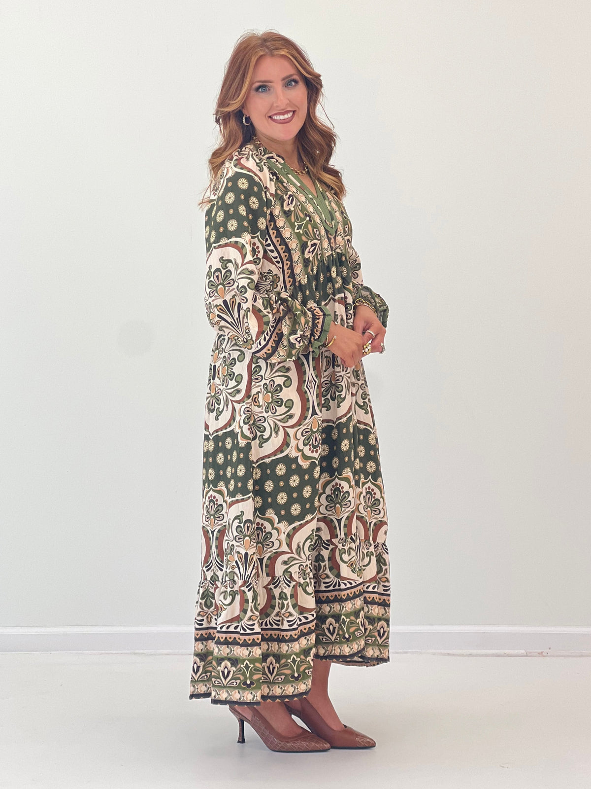 Abstract print midi dress with contrast trim, V-neck, long sleeves, and pockets