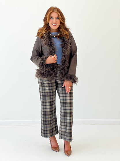 Dark faux fur-trim vegan leather jacket with shaggy open front and long sleeves