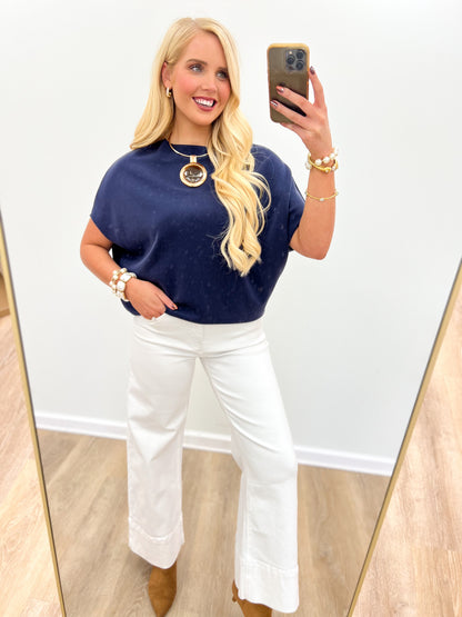 Navy short sleeve scuba dolman top with relaxed fit and round crew neckline