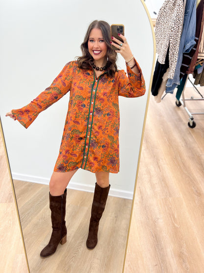 Orange floral bell-sleeve button dress with dark trim, long sleeves and short hem