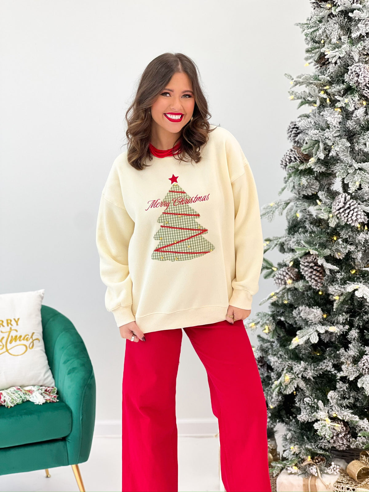 Cream oversized sweatshirt with Christmas tree graphic and red “Merry Christmas” lettering