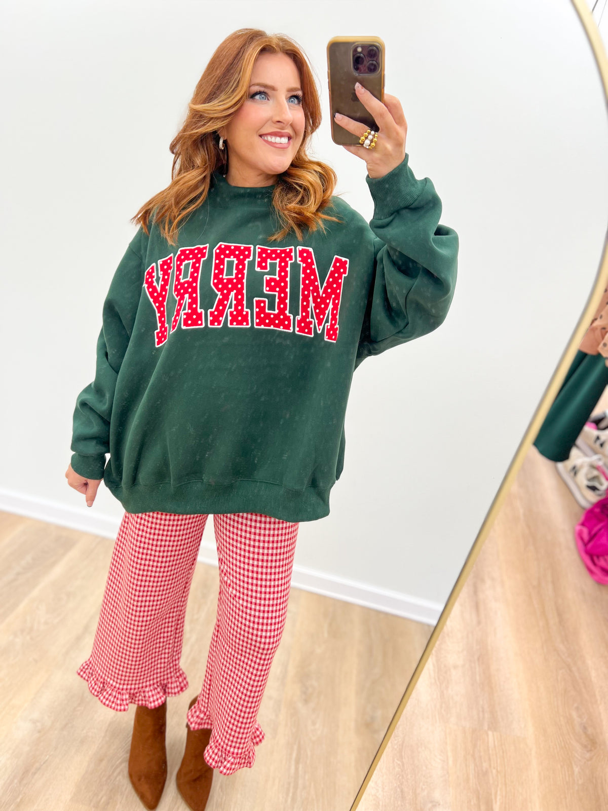 Hunter green oversized mock-neck sweatshirt with 'MERRY' graphic front