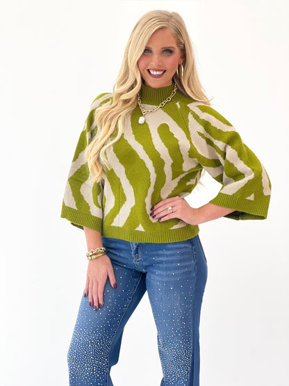 Olive abstract print knit sweater top with ribbed mock neck and wide sleeves