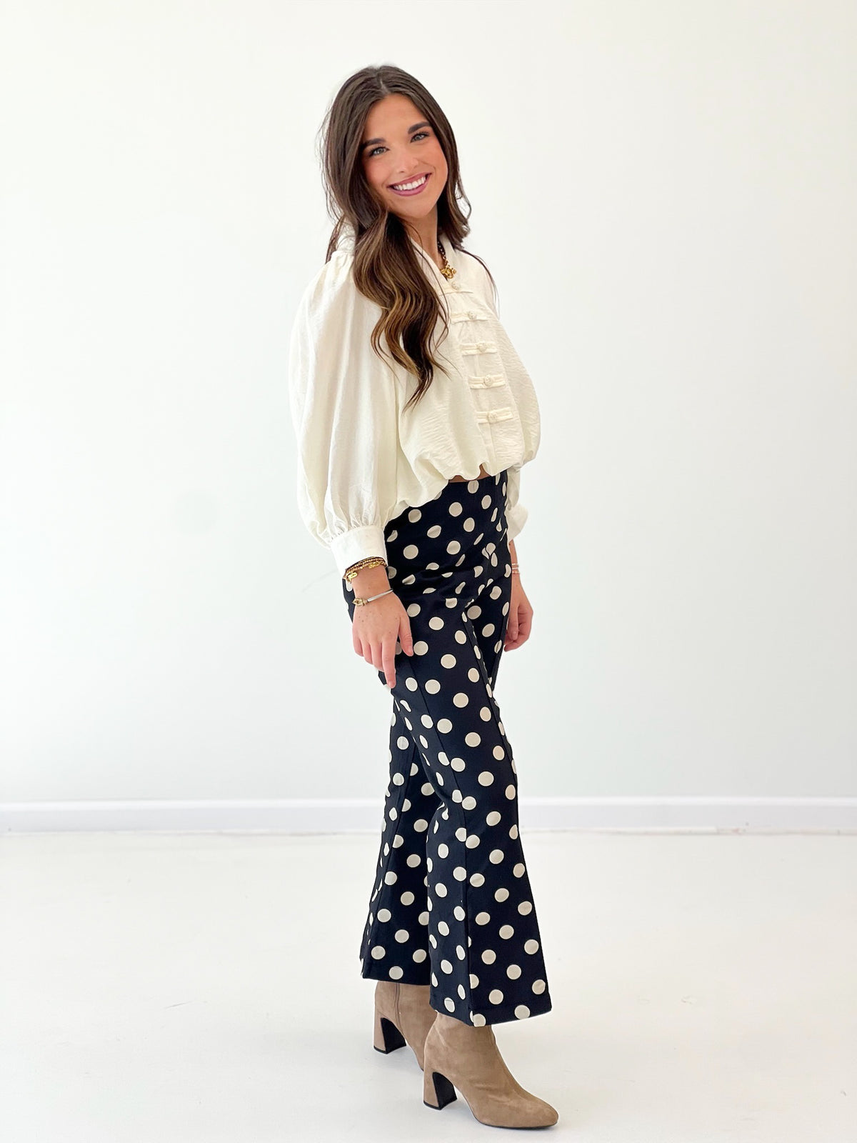 Cream puff-sleeve blouse with ruffled front and gathered neckline, elastic cuffs