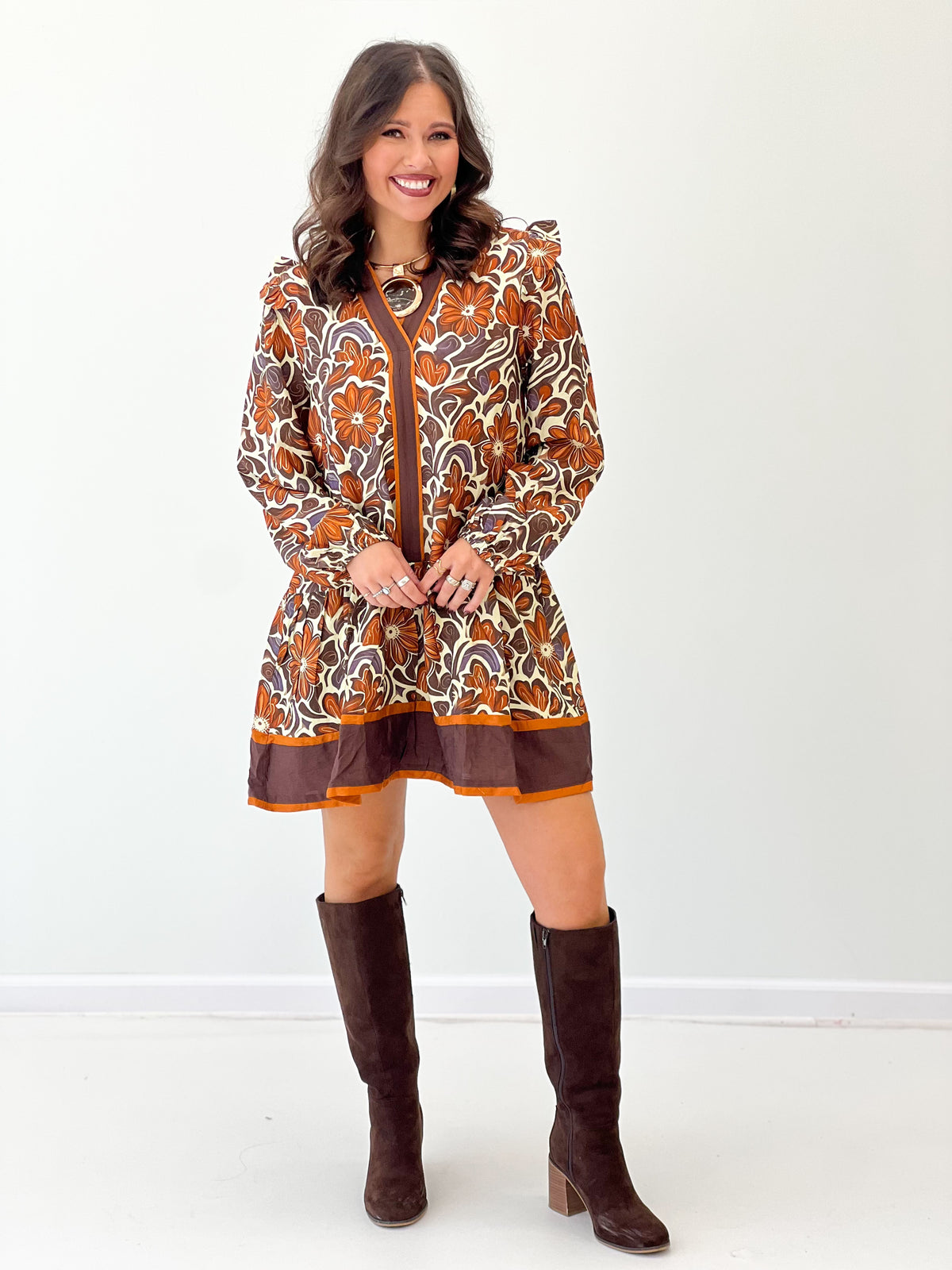 Brown floral V-neck ruffle detail dress with long puff sleeves and tiered hem