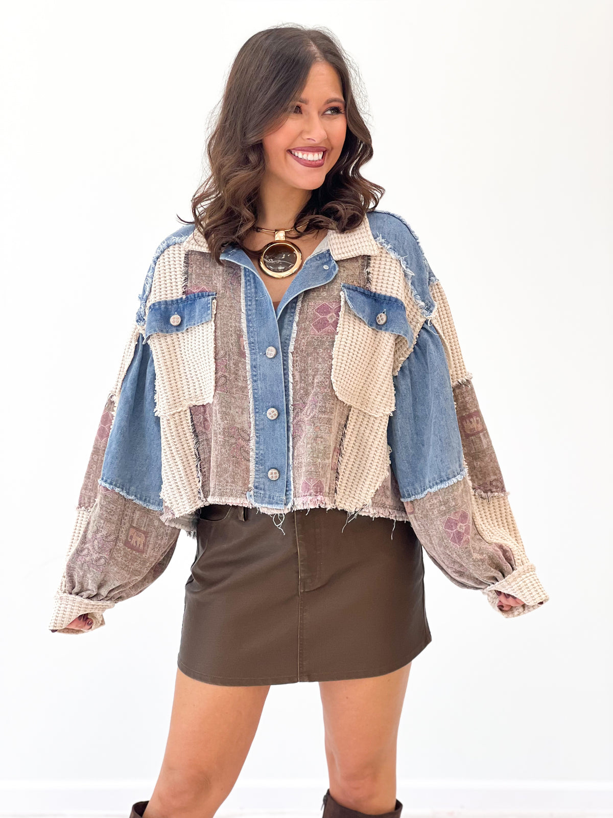 Patchwork long-sleeve shacket with button front, chest pockets, frayed hem; denim and oat