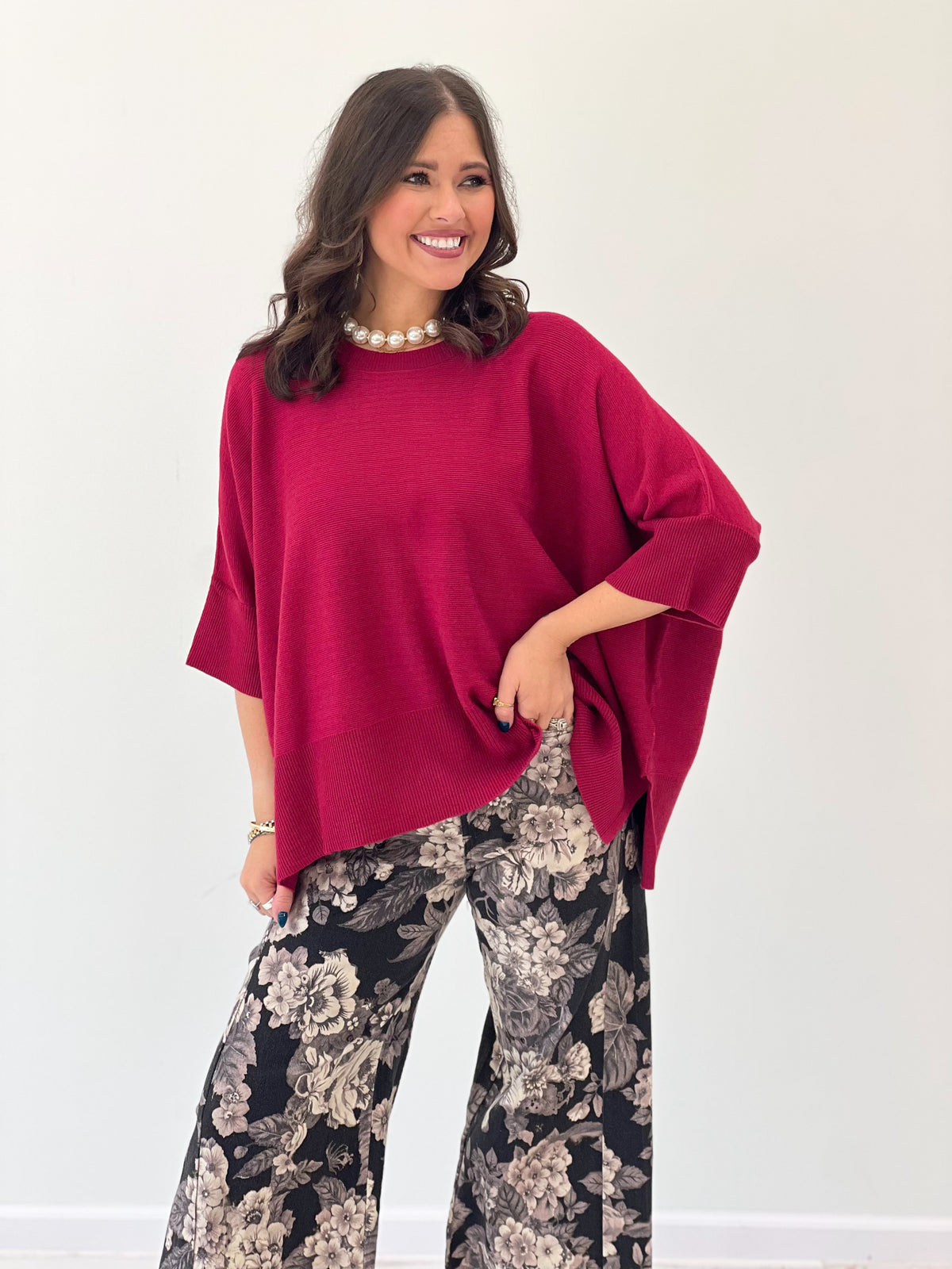Crimson oversized pullover sweater with round neck and flowing loose sleeves