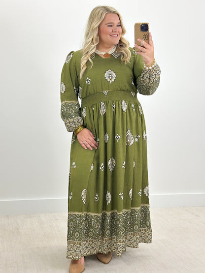 Olive green long-sleeve border print dress with lace-trim neckline and allover motifs