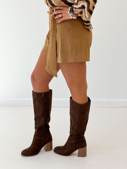 Camel suede belted shorts close-up with asymmetrical front and fold-over hem