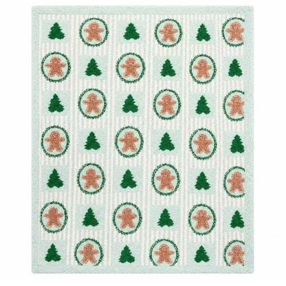 Thomas and Lee soft blanket with mint pattern of gingerbread cookies and green tree icons.