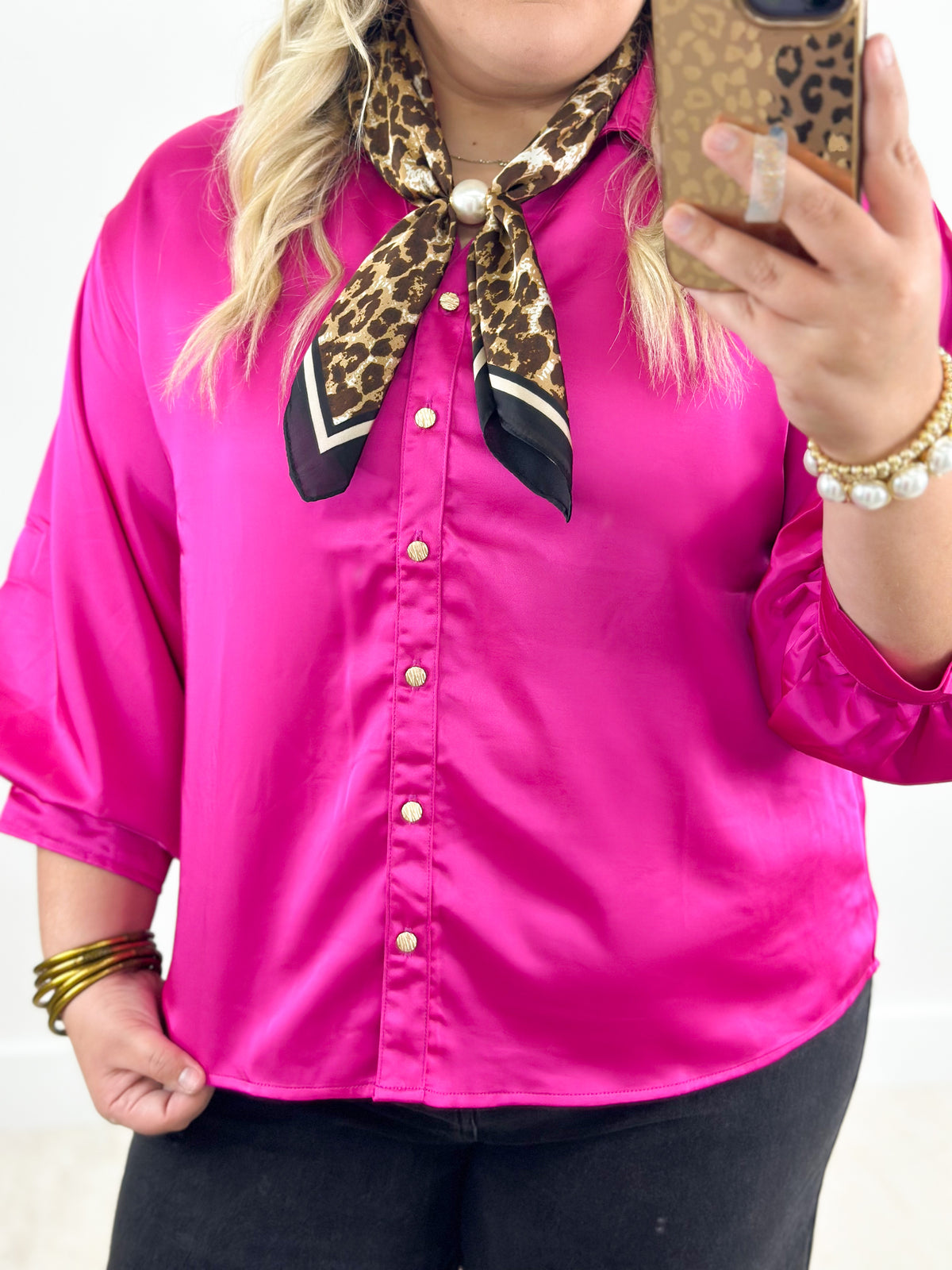 Fuchsia button-front shirt with puff sleeves and rolled gold-tone cuffs