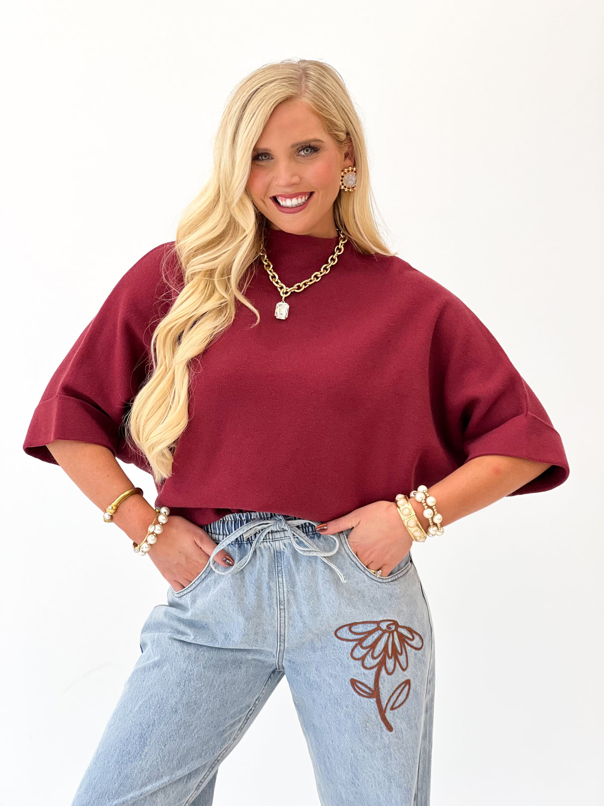 Burgundy mock-neck pullover sweater with wide dolman-style short sleeves