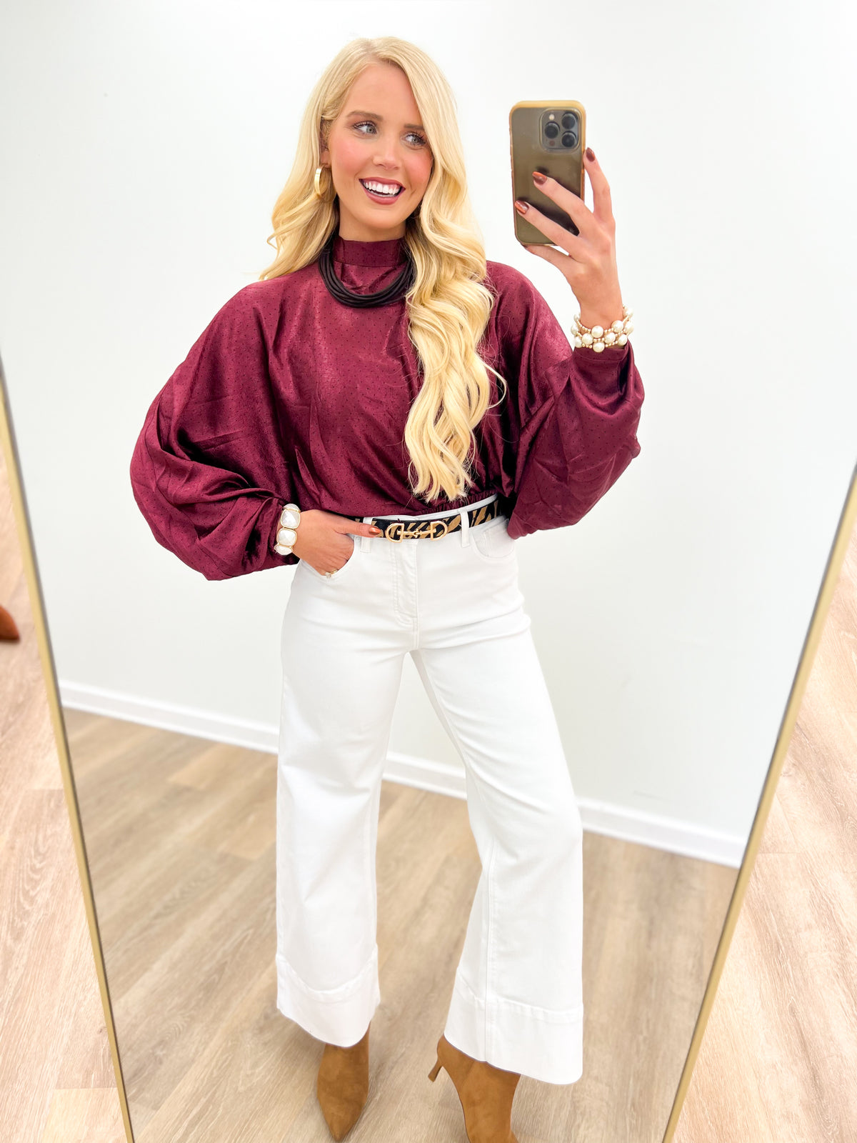 Burgundy polka dot high-neck blouse with long puff sleeves