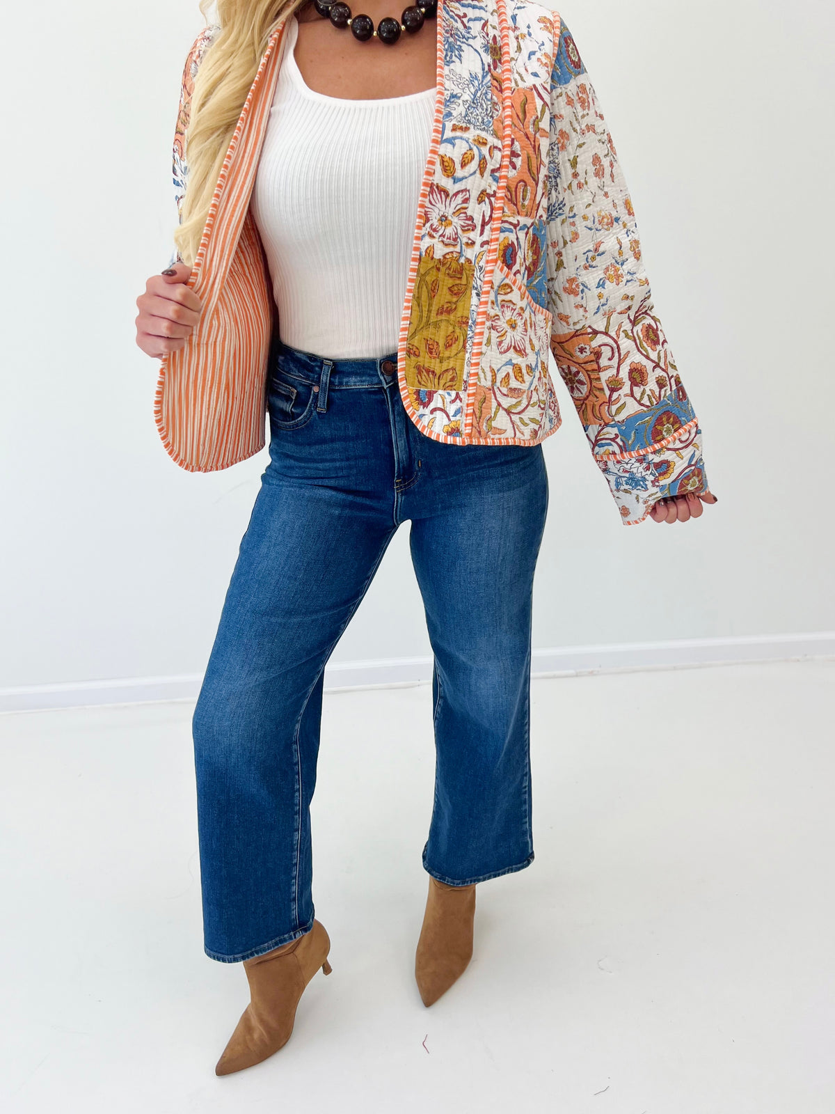 Quilted kimono-style jacket with multicolor print, open front, and long sleeves