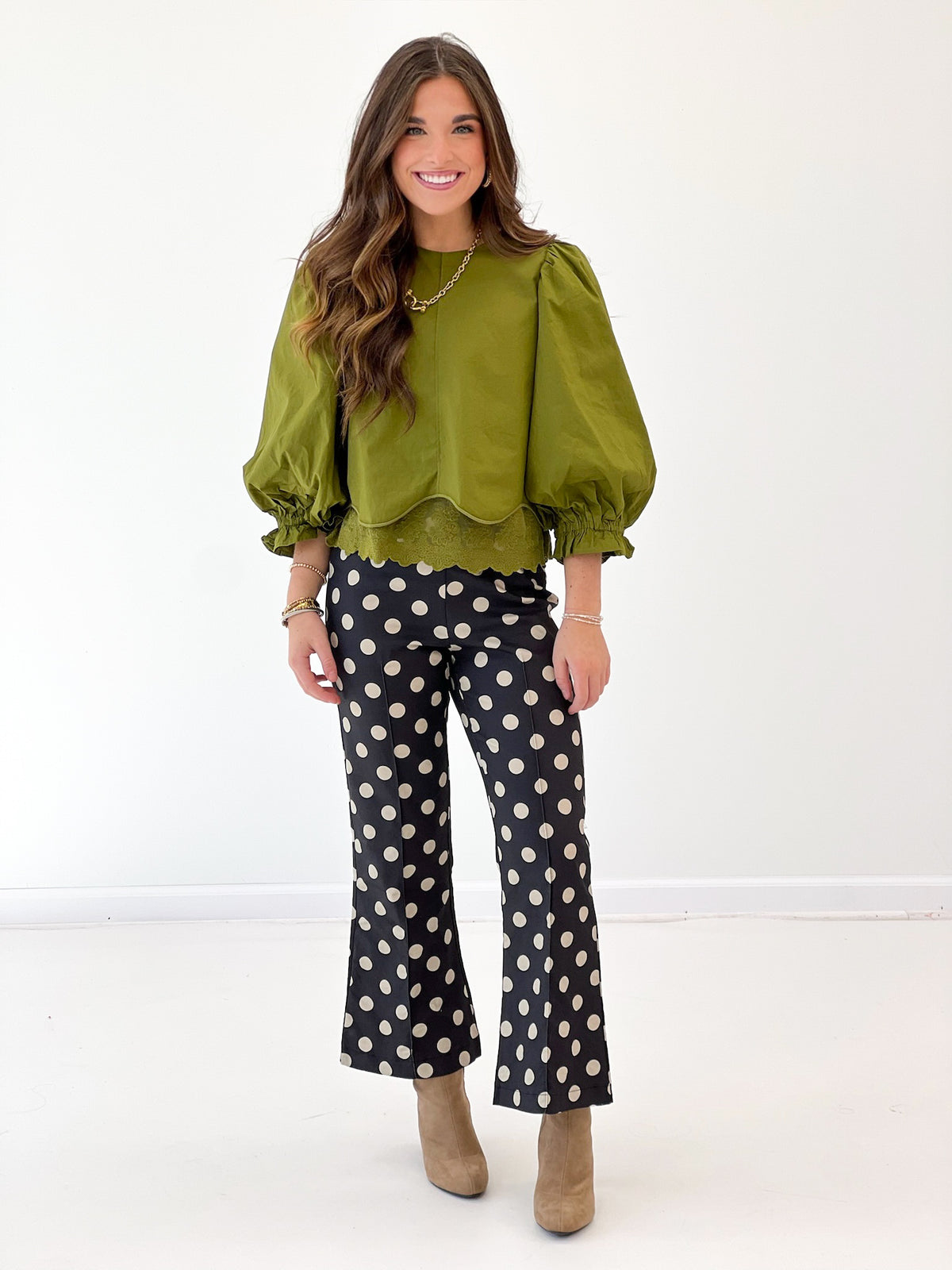 Olive green balloon sleeve lace-trim top with scalloped hem and scoop neckline