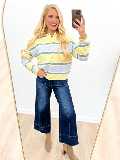 Butter-striped long sleeve cardigan with button front, ribbed cuffs, soft knit.