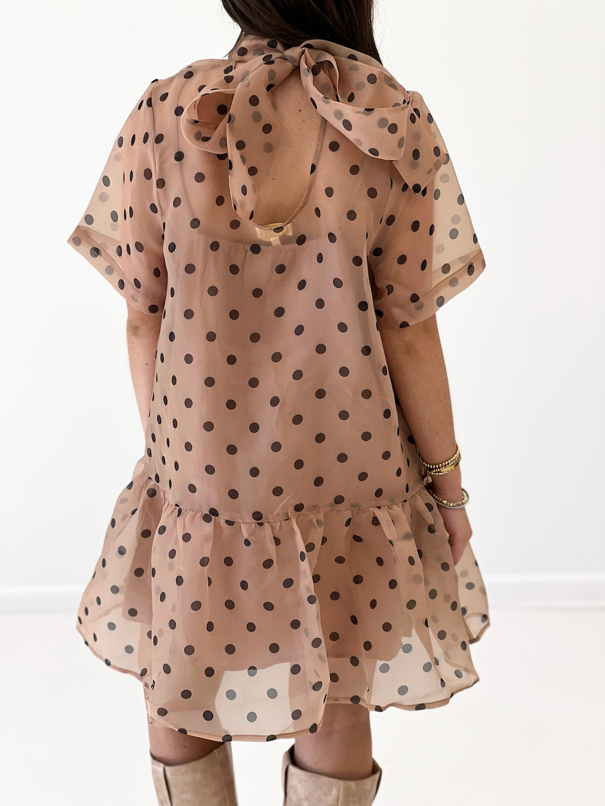 Ecru polka dot mini dress with back tie bow and layered ruffle skirt