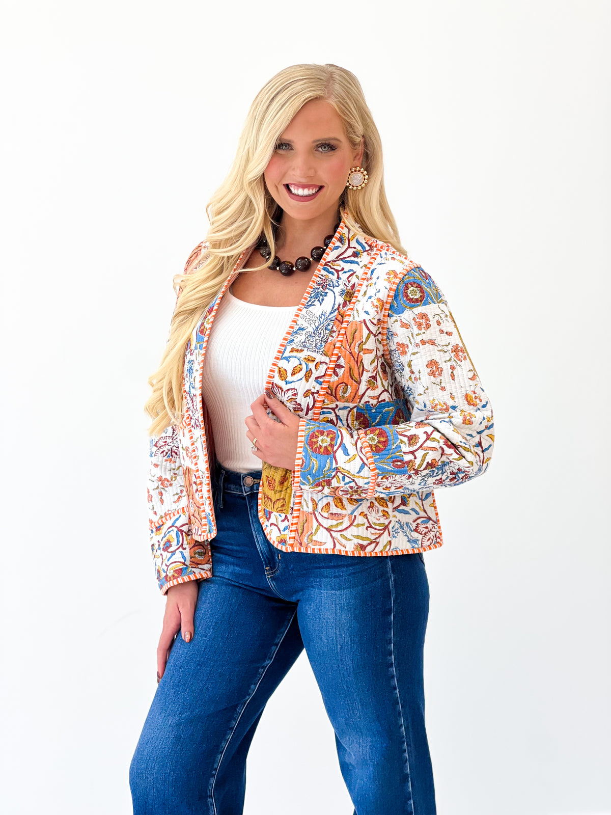 Quilted kimono-style jacket with multicolor print, open front, and long sleeves