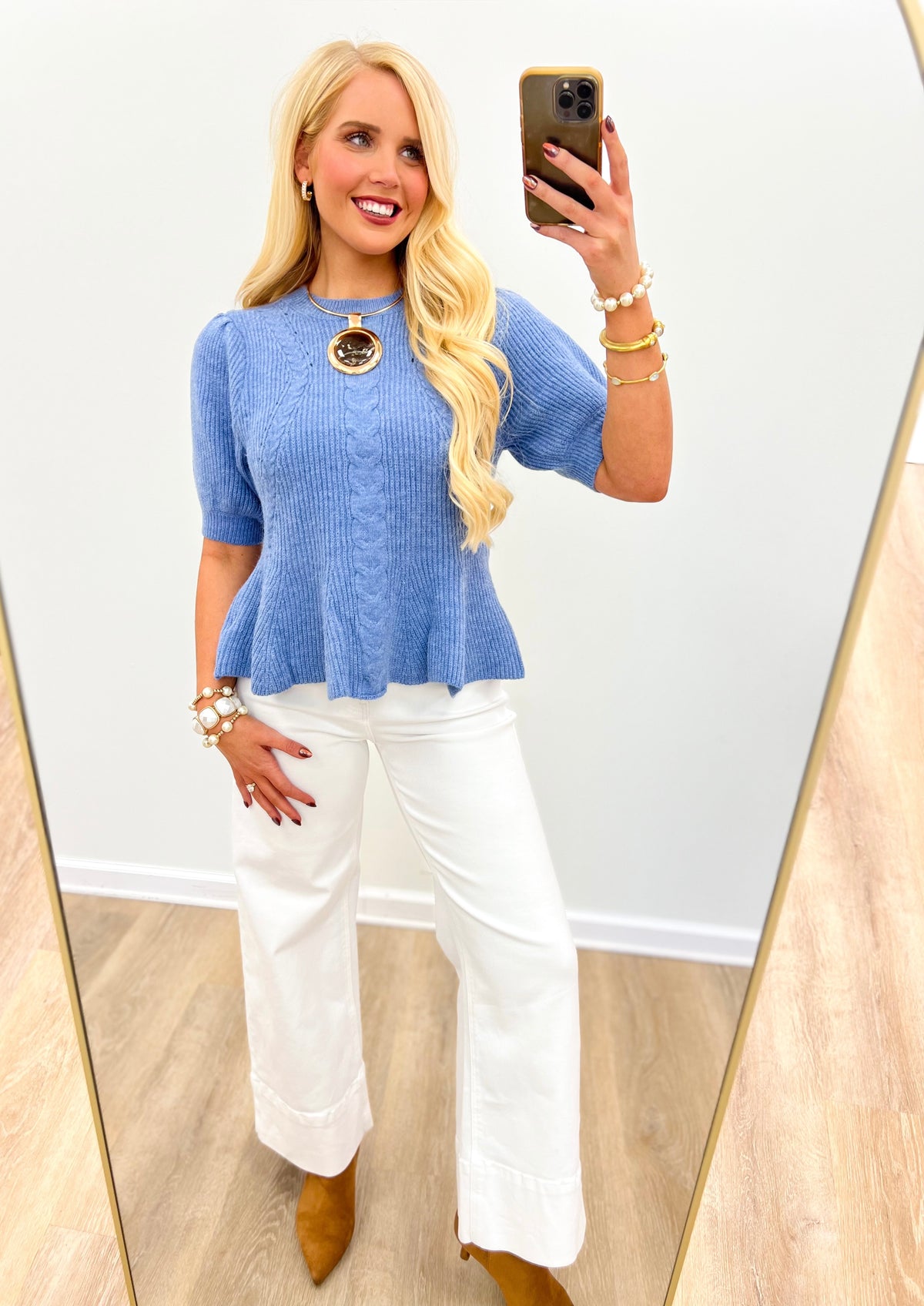 Blue knit sweater top with round neck, short sleeves, peplum-style flare hem