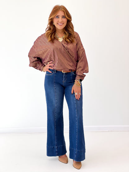 Burgundy metallic stripe wrap blouse with V-neck, long puff sleeves and gathered cuffs