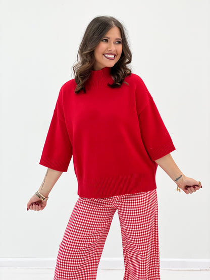 Red knit mock neck short-sleeve sweater with ribbed cuffs and hem
