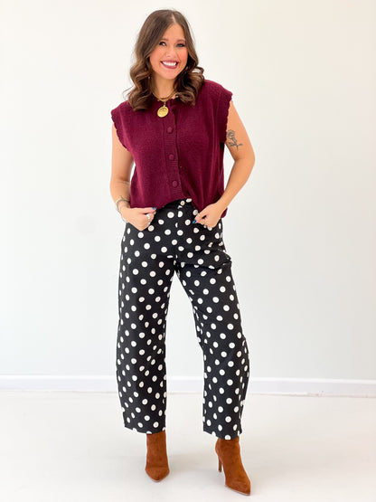 Burgundy ribbed button-down sweater vest with scalloped shoulders and front button placket