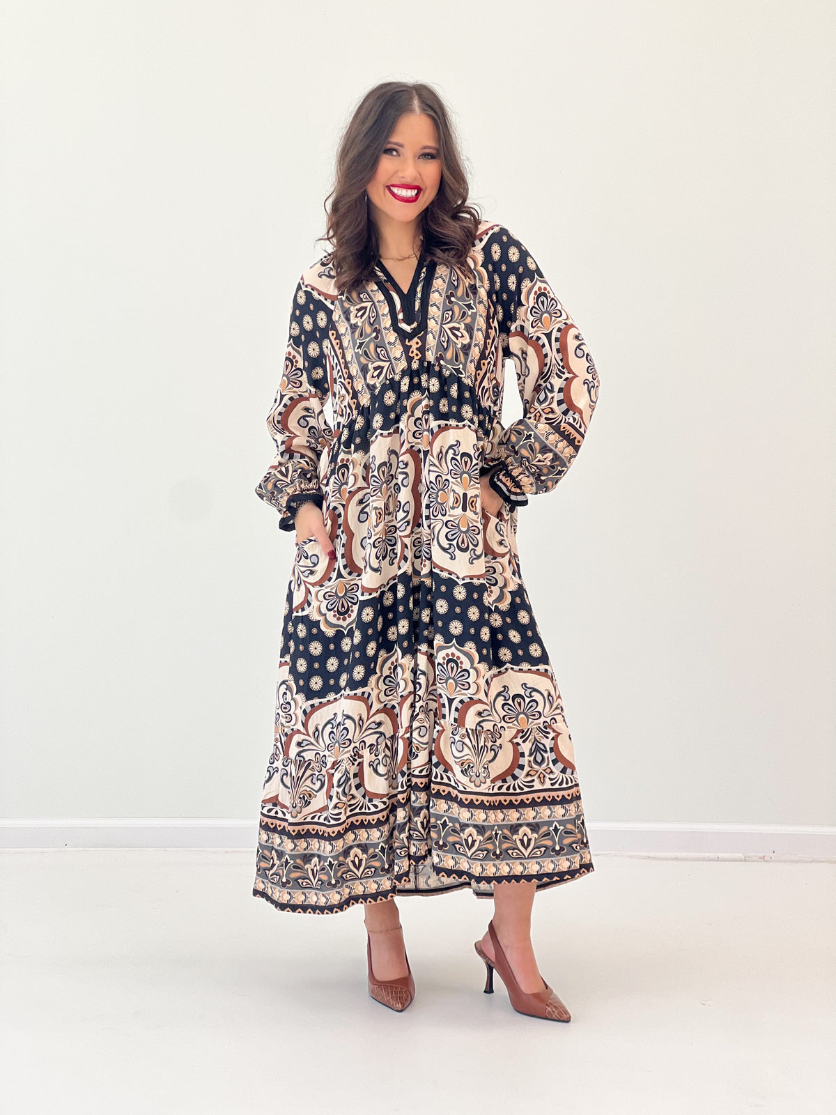 Abstract print midi dress with contrast trim, V-neck, and ruffled hem