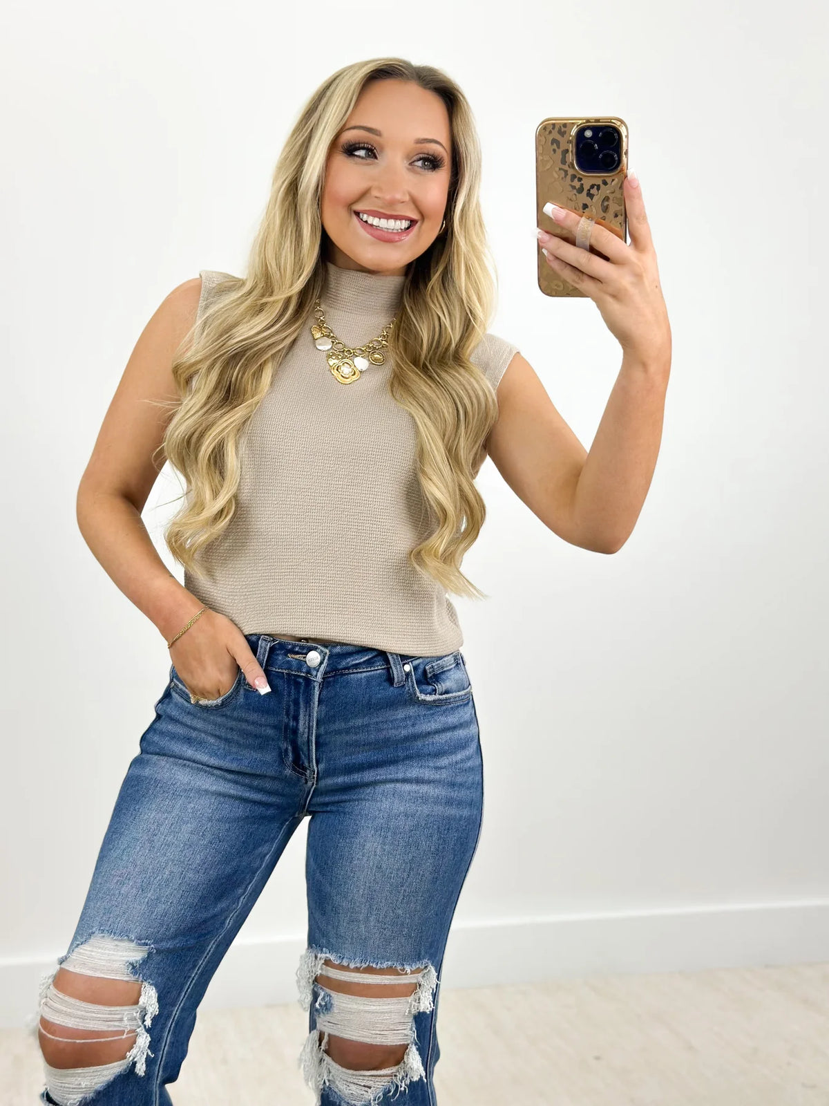 Taupe sleeveless knit mock neck top, high neckline and close fit front view