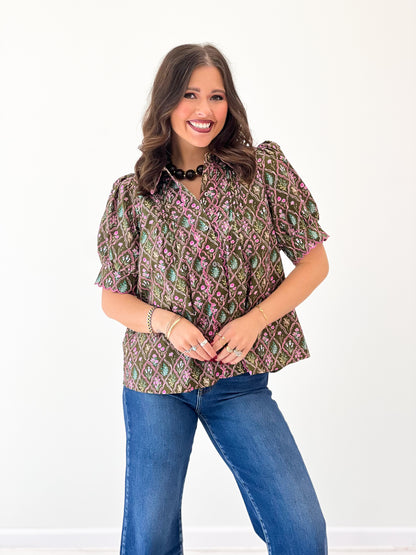 Floral pintuck puff-sleeve top with V-neck and patterned dark brown base