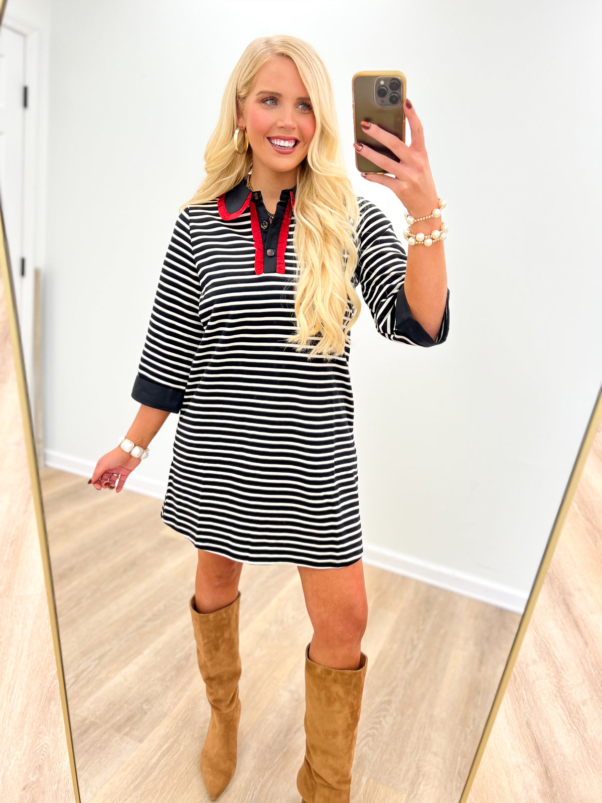 Black-and-white striped dress with red-trim ruffle collar, three-quarter sleeves