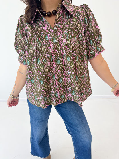 Close-up floral pintuck puff-sleeve V-neck top with textured front detail