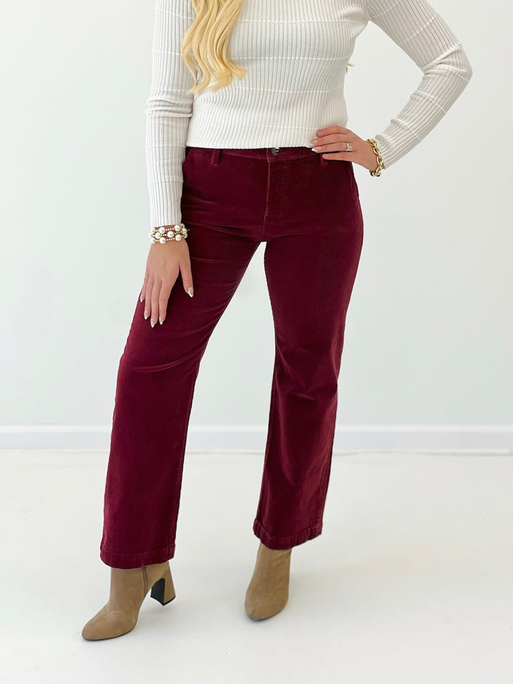 Wine mid-rise ankle straight corduroy pants with front button, belt loops, and pockets