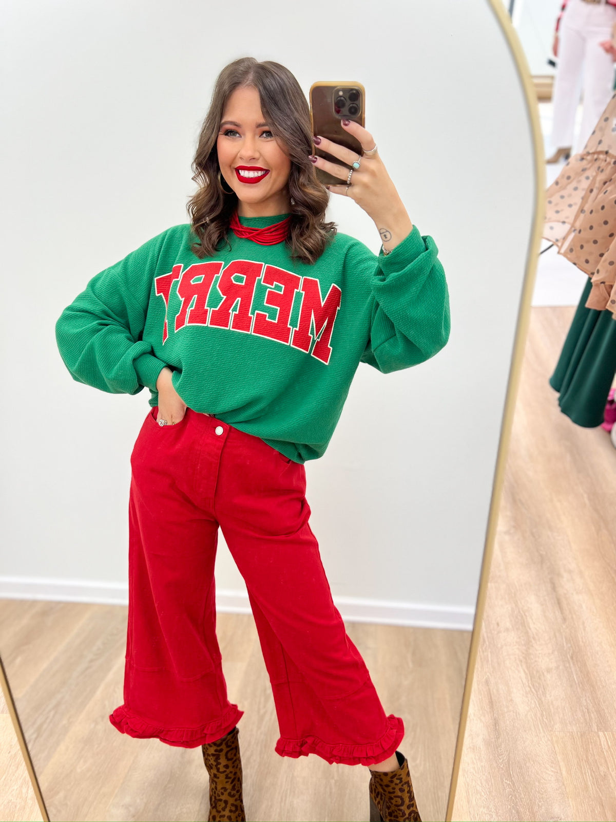 Green knit Christmas top with 'MERRY' graphic, ribbed crew neckline and long sleeves