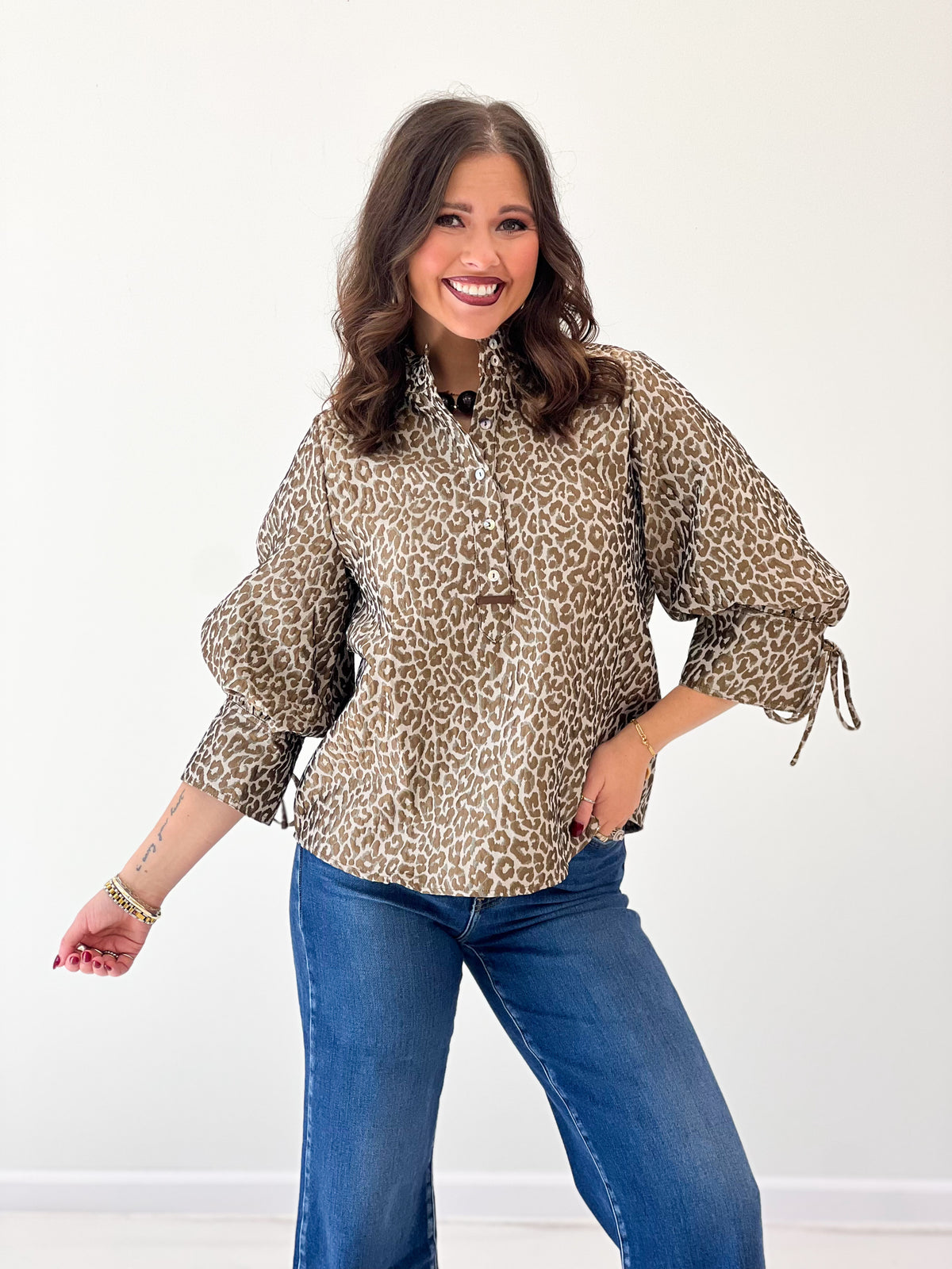 Taupe leopard jacquard button-up top with stand collar and puff sleeves.