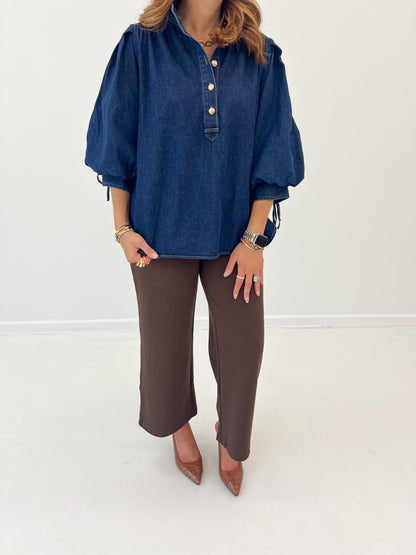 Dark denim puff-sleeve top with buttoned henley placket