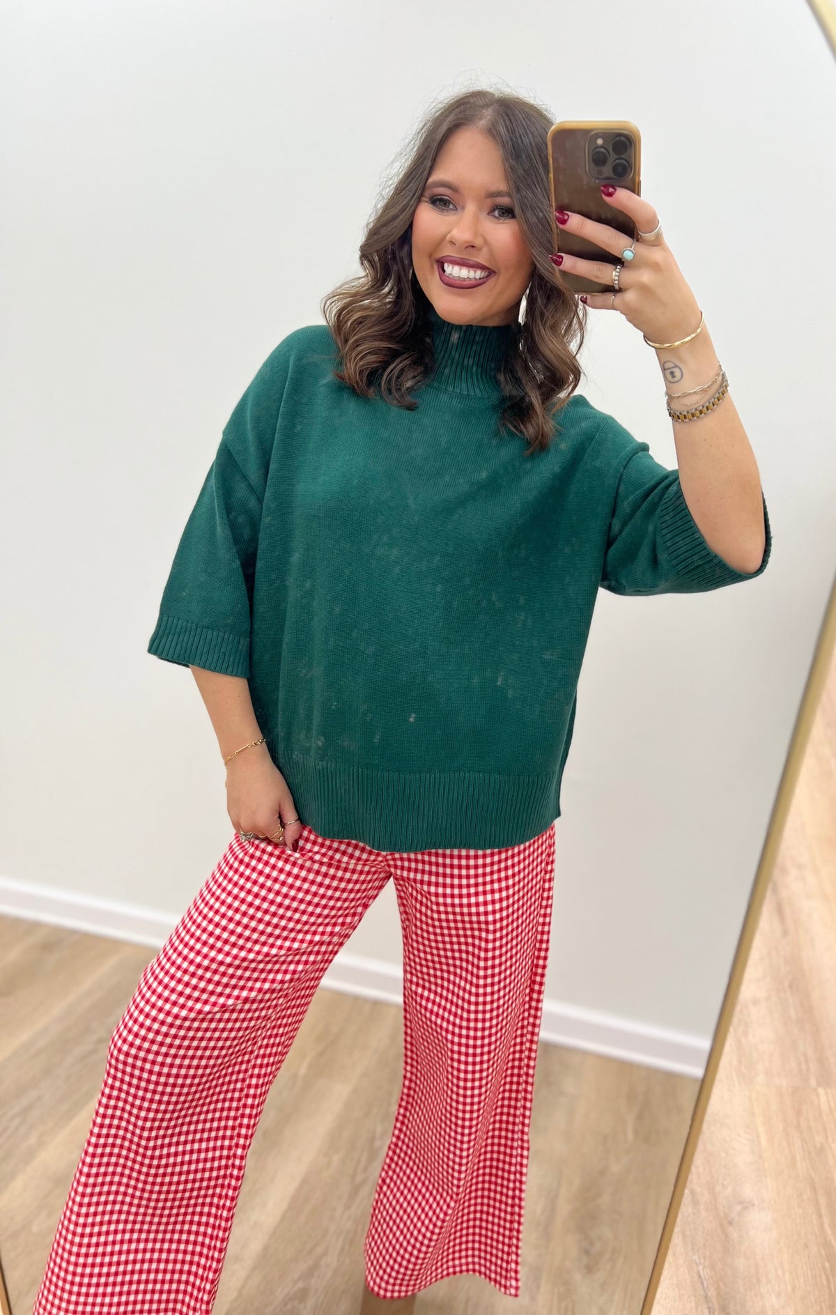 Hunter green mock neck short-sleeve sweater with ribbed hem detail