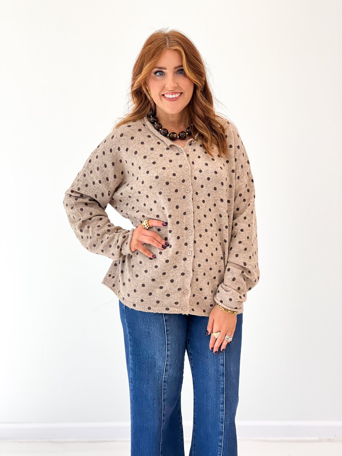 Light mocha polka-dot button cardigan with long sleeves and cuffed raw edges